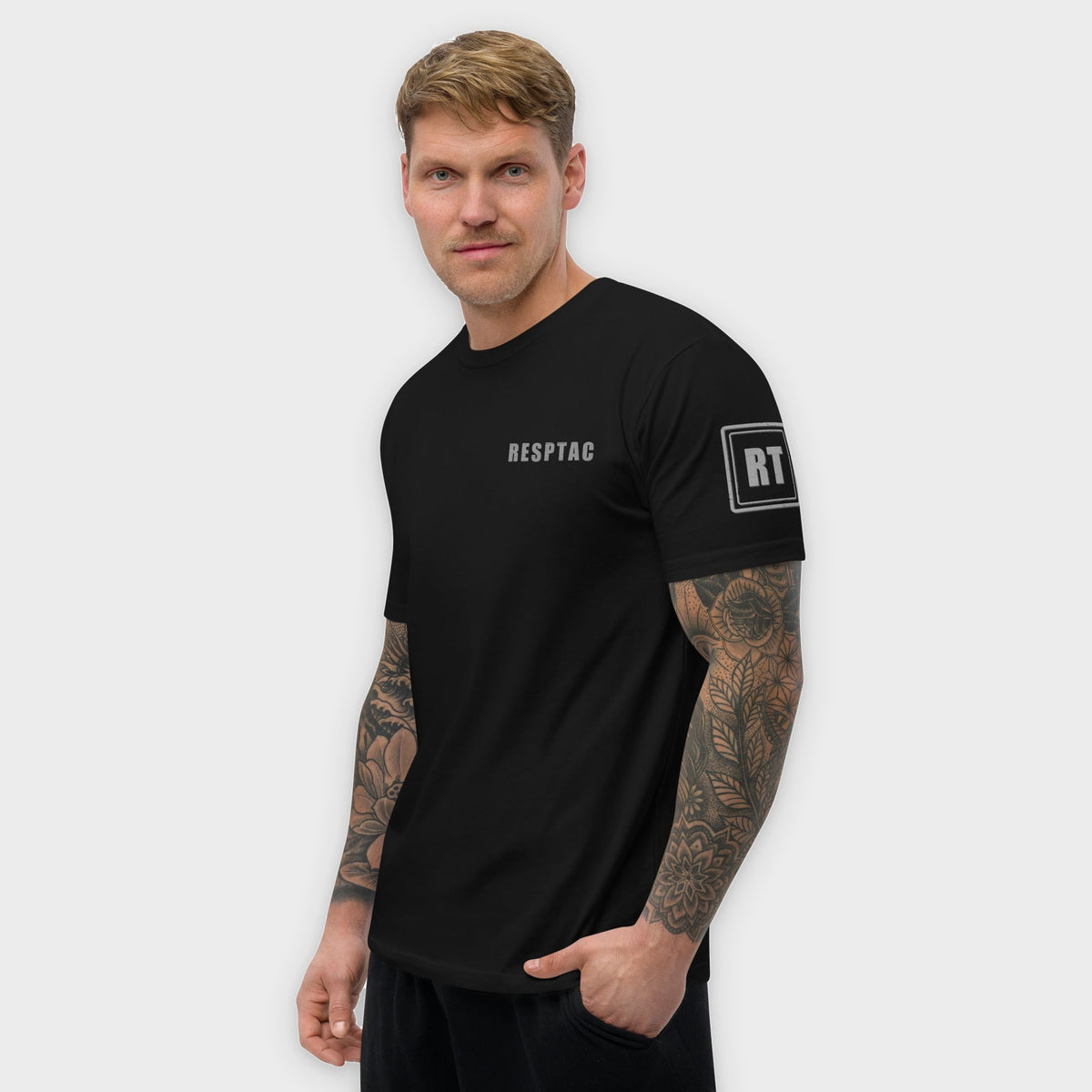 CORE BLACKOUT tee left side on model, studio background